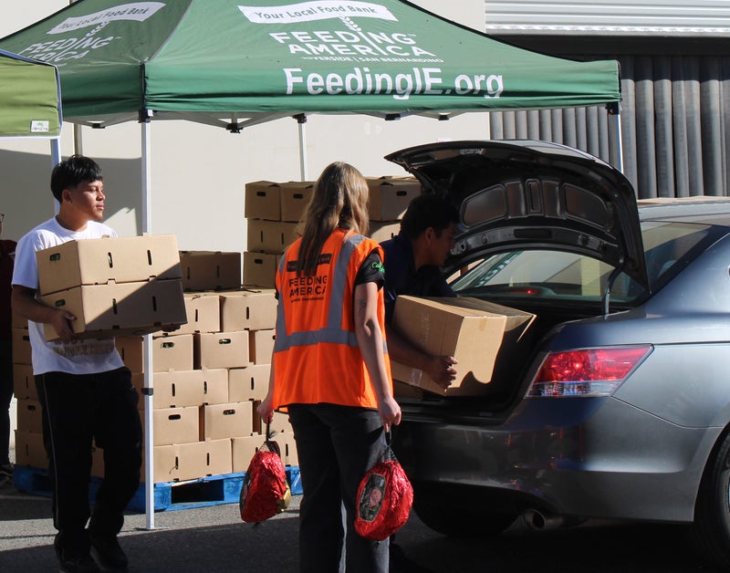 Mother's Day Food Distribution: Hams, Fresh Produce, and More - Slide 